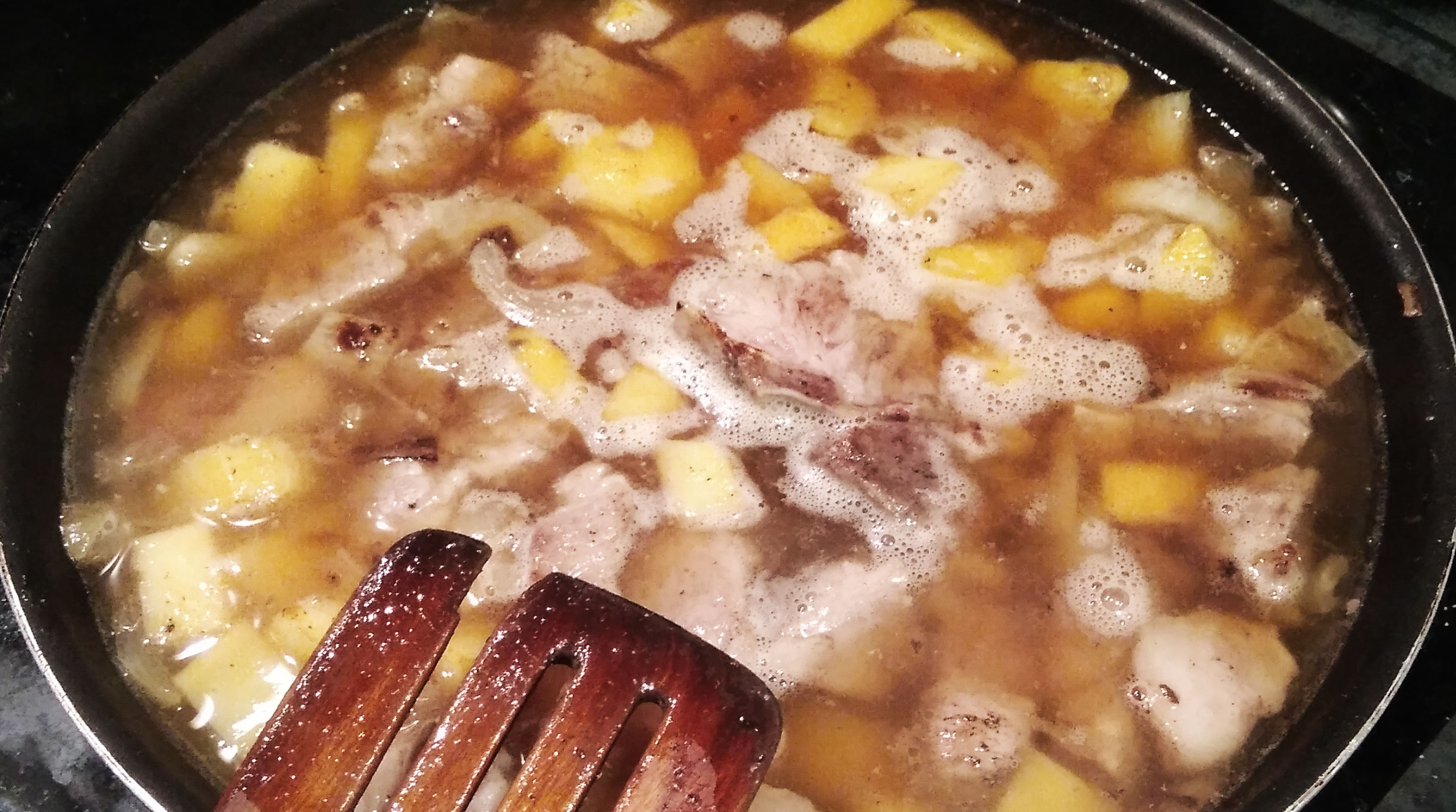 adding water to the curry